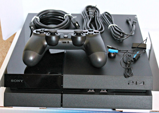 Inside the Box - The Console, power cord, one controller, a USB cable to charge the controller, a HDMI cable, and a headset.