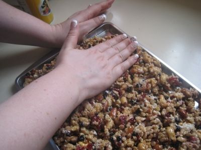 Trail Mix bars being pressed into pan