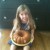 Beautiful child with her pound cake out of the pan.