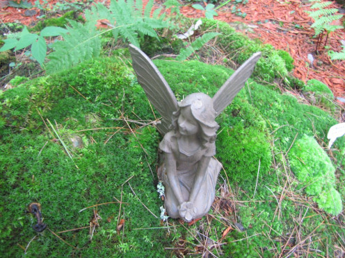 My first fairy from this series. This mossy spot is a perfect place for her to relax and survey the garden.